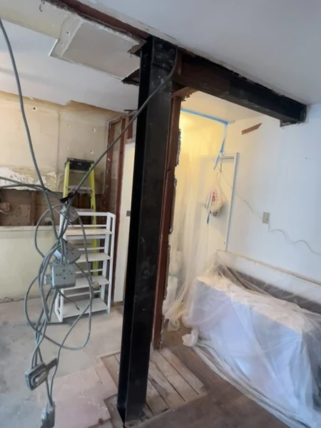 New electrical, lighting and plumbing runs at the reframed Bayside kitchen opening before board and tile