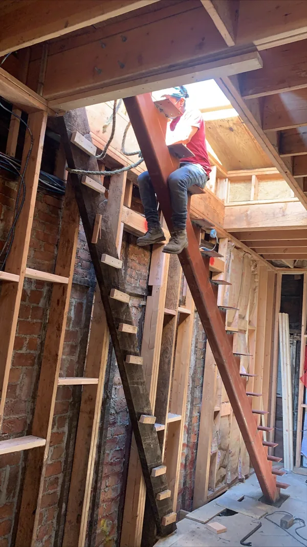 Early framing stage of the stairwell before the stair took shape.