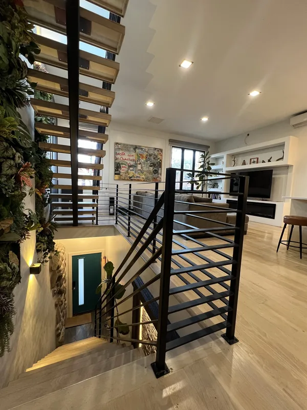 The stair base and open living area.
