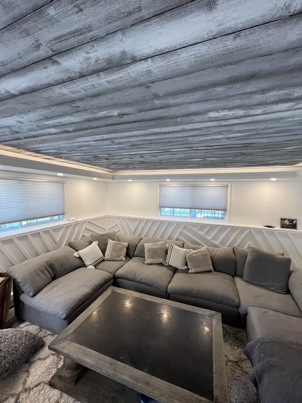 High-angle view of the seating area, millwork and tray ceiling.