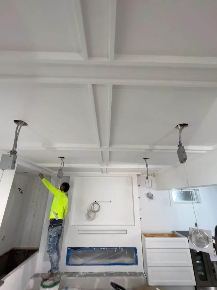 Our crew installing the coffered ceiling on site in the Roslyn Harbor basement.