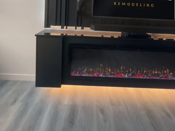 Detail of the linear electric fireplace recessed flush into the floating console face