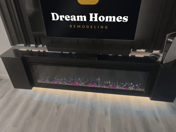 Angled view of the floating console, linear fireplace and underlighting