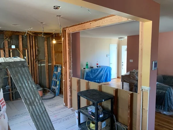 Framing: new studs at the widened kitchen-to-dining opening with ceiling wiring for recessed lights