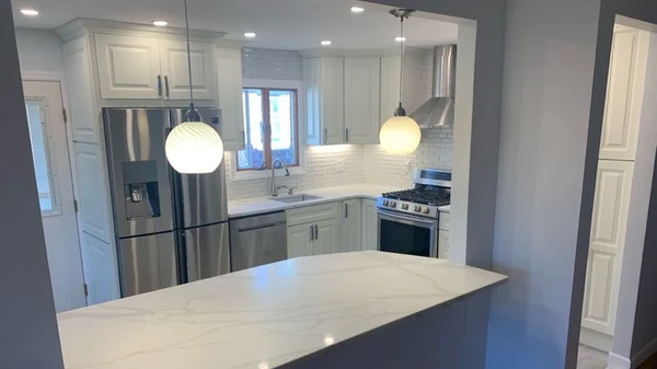 After: wide view of the completed open-concept Whitestone kitchen remodel